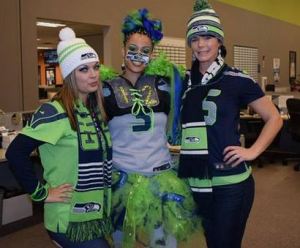 three comcast employees wearing Seahawks colors